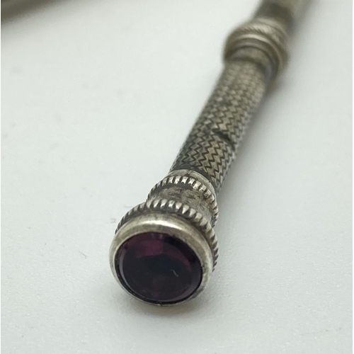 1195 - A silver filled propelling pencil by Eversharp with engine turned decoration and initials 