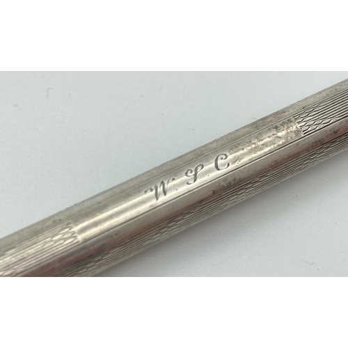 1195 - A silver filled propelling pencil by Eversharp with engine turned decoration and initials 