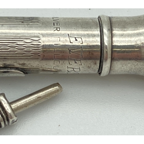 1195 - A silver filled propelling pencil by Eversharp with engine turned decoration and initials 