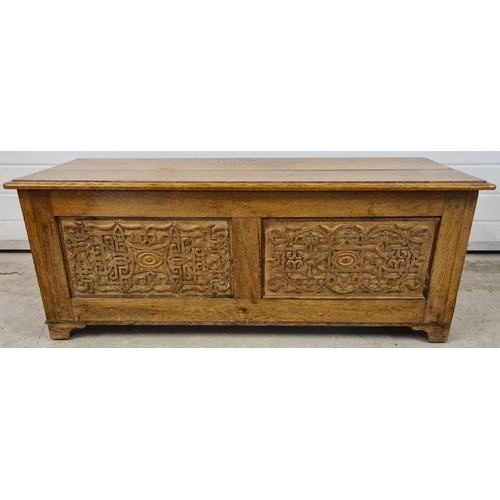 1468 - A vintage medium oak linen chest with decorative carved panel detail to front & sides. Approx. 46cm ... 