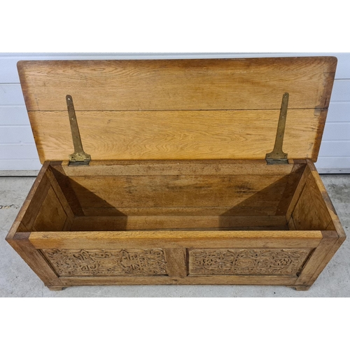 1468 - A vintage medium oak linen chest with decorative carved panel detail to front & sides. Approx. 46cm ... 