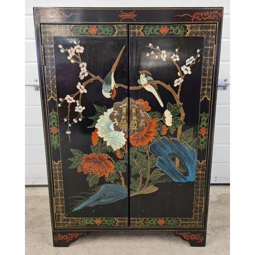 1472 - A vintage Chinese black lacquer 2 door cupboard with hand painted floral & bird detail. With decorat... 