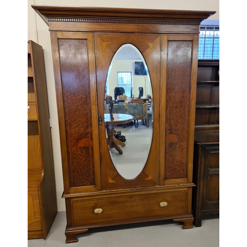 1473 - An Edwardian satin wood single door wardrobe with maple panels and inlaid detail. In 3 sections, bas... 