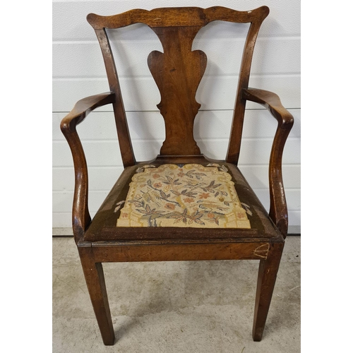 1475 - A Georgian walnut carver armchair with square legs, shaped back & back panel and needlepoint upholst... 