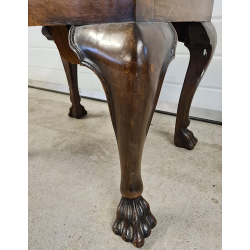 1476 - A Georgian walnut claw foot stool with chunky cabriole shaped legs. Approx. 47cm tall x 60cm wide.