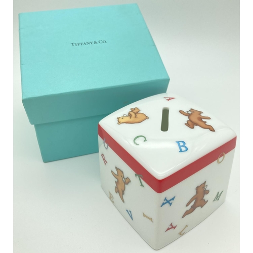 1293 - A boxed Tiffany & Co 2006 Alphabet Bears square ceramic money box. Approx. 8.5 cm tall.