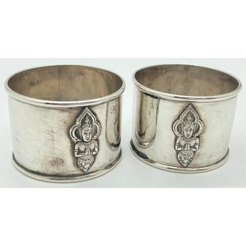 1201 - A pair of vintage sterling silver napkin rings with oriental deity decoration to front and back. Mar... 