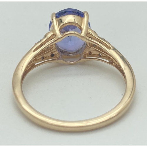 1066 - A 9ct gold, amethyst and diamond dress ring by The Genuine Gem Company. Central oval cut amethyst wi... 