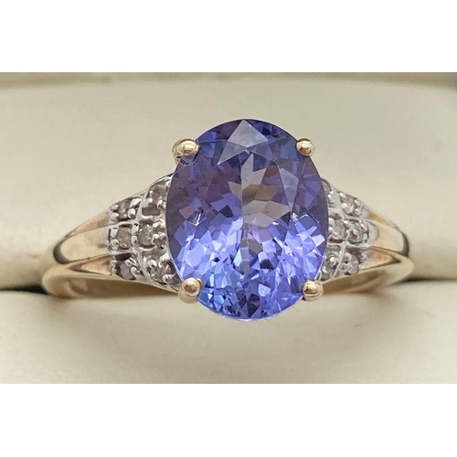 1066 - A 9ct gold, amethyst and diamond dress ring by The Genuine Gem Company. Central oval cut amethyst wi... 