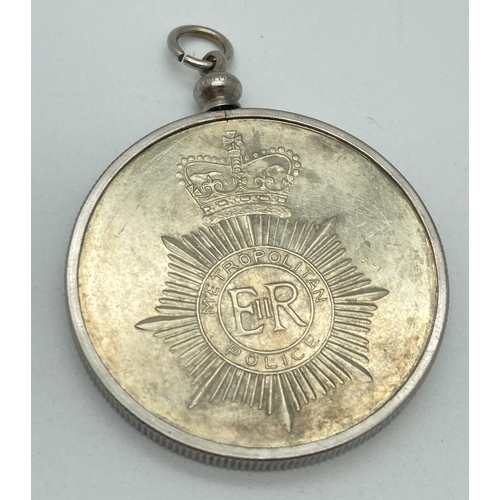 1229 - A Metropolitan Police 150th Anniversary coin/medallion in a white metal mount with necklace hanging ... 