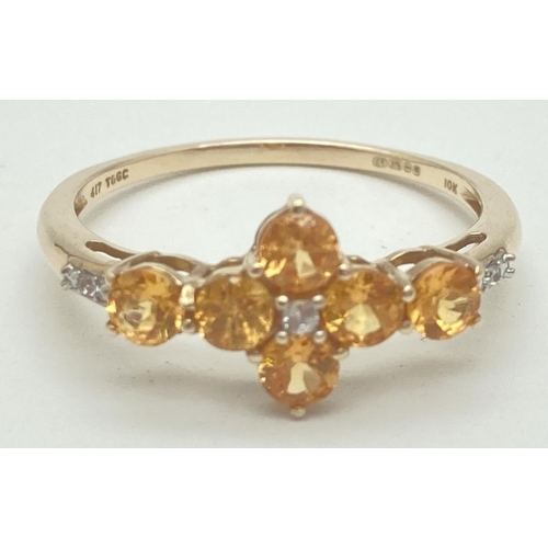 1068 - A 9ct gold citrine and diamond set dress ring by The Genuine Gem Company. 6 round cut citrine stones... 