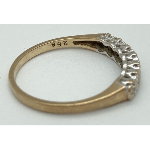 1070 - A 9ct gold and diamond half eternity ring with 7 illusion set stones. Fully hallmarked inside band, ... 