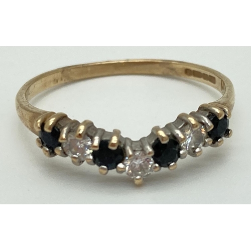 1073 - A 9ct gold, sapphire and cubic zirconia half eternity wishbone ring. Ring size N, total weight appro... 