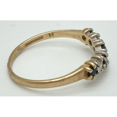 1073 - A 9ct gold, sapphire and cubic zirconia half eternity wishbone ring. Ring size N, total weight appro... 