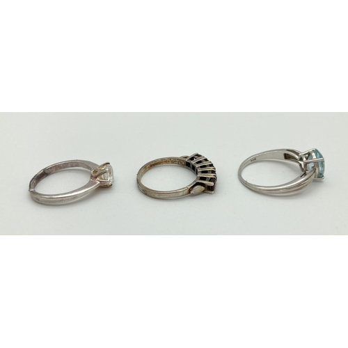 1077 - 3 925 silver stone set rings, all stamped inside of bands. A cubic zirconia solitaire ring (size L),... 