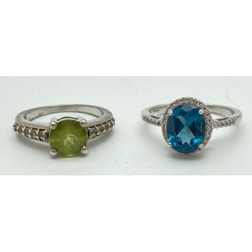 1085 - 2 coloured and clear stone set 925 silver rings. A Genuine Gem Company peridot ring set with 5 clear... 