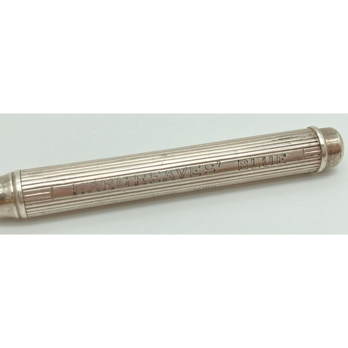 1205 - An Edwardian silver Sampson Morden & Co advertising propelling pencil. Chanelled detail to body, rea... 