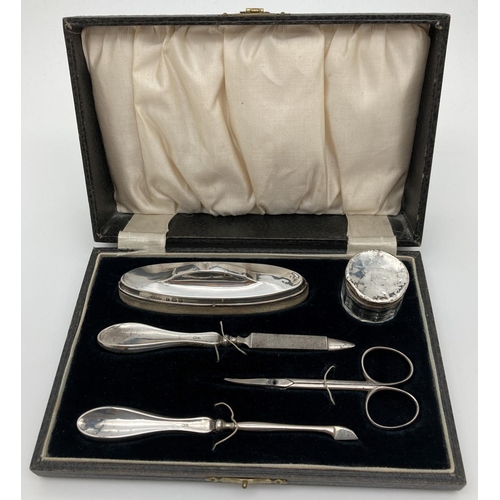 1208 - A 1930's silver manicure set in original black velvet lined case. All fully hallmarked for Birmingha... 