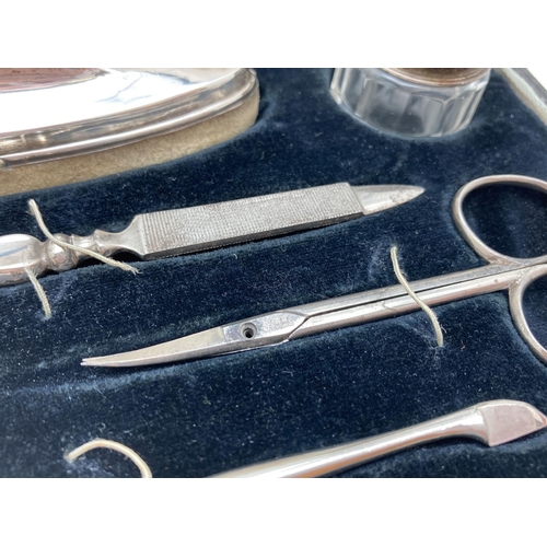 1208 - A 1930's silver manicure set in original black velvet lined case. All fully hallmarked for Birmingha... 