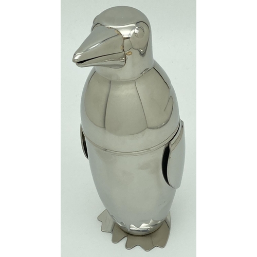 1209 - A novelty cocktail shaker in the form of a penguin. Approx. 22.5cm.