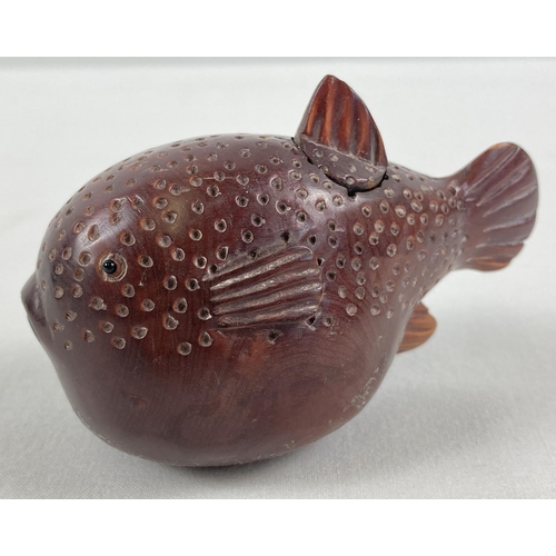 1304 - A small Japanese carved fruitwood snuff pot in the form of a pufferfish. Set with small mother of pe... 