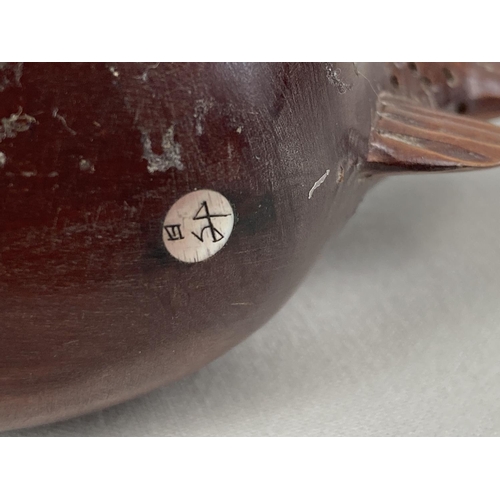 1304 - A small Japanese carved fruitwood snuff pot in the form of a pufferfish. Set with small mother of pe... 