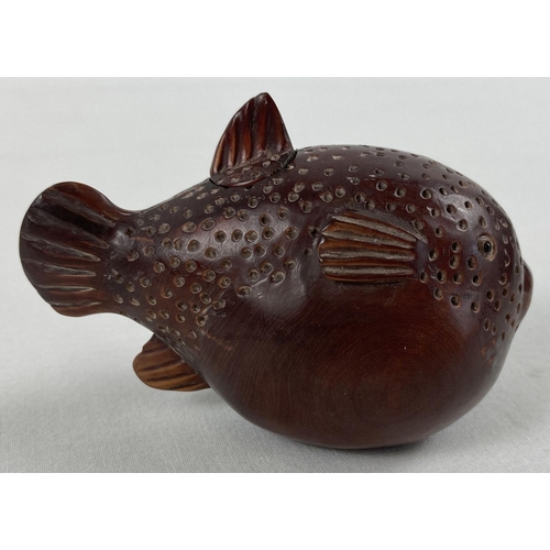 1304 - A small Japanese carved fruitwood snuff pot in the form of a pufferfish. Set with small mother of pe... 