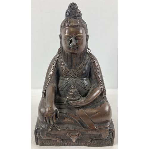 1306 - A large Chinese hollow bronze figure of seated Buddha. Approx. 29cm tall.