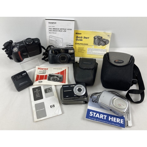 1335 - A box of assorted cameras and accessories to include Olympus, Nikon and Pentax.