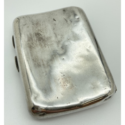 1214 - A Victorian silver curve backed cigarette case with engraved emblem to front. Hallmarked to both sid... 