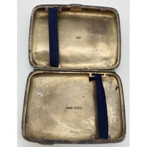 1214 - A Victorian silver curve backed cigarette case with engraved emblem to front. Hallmarked to both sid... 