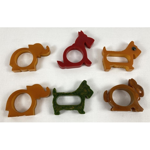 1377 - 5 Art Deco coloured bakelite napkin rings in the shape of animals. 2 x elephants and 3 x dogs togeth... 