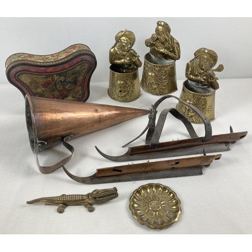 1249 - A box of assorted vintage metal ware. To include brass inlaid ice skates, a large copper funnel, a b... 