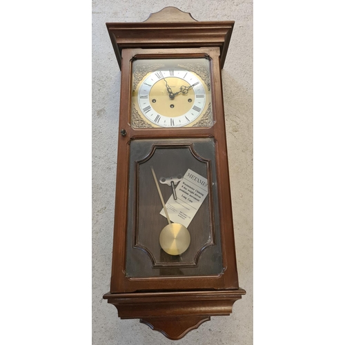 1258 - A vintage wooden cased Metamec Westminster chiming, 8 day weight driven wall clock. Complete with pe... 