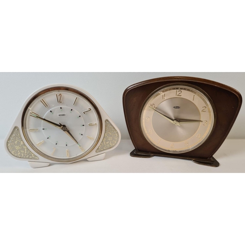 1262 - 2 mid century Metamec wind up mantel clocks. A wooden fronted clock with brass feet and gold coloure... 