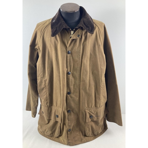 66 - A men's A821 classic Moorland wax jacket by Barbour. Double fastener zip to front with press stud de... 