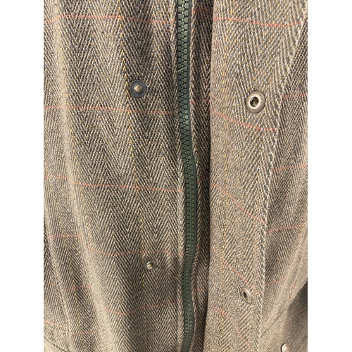 67 - A men's green tweed field jacket by Hoggs of Fife. Front zip and press stud fastening. 4 front pocke... 