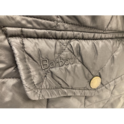 69 - A mens black quilted jacket by Barbour. Zip and press stud fastening with 3 front pockets and 2 inte... 