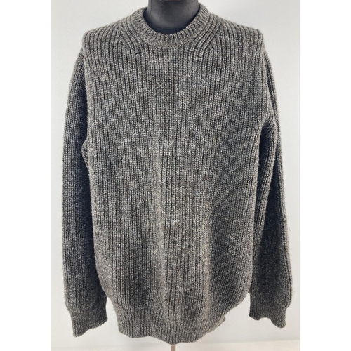 72 - A men's chunky knit fisherman's style green fleck jumper by Barbour. Size L. Barbour label to neck o... 