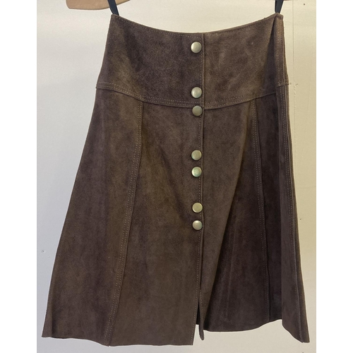 238 - A 1970's womens chocolate brown suede A line mini skirt with press stud fastening to front. 22 inch ... 