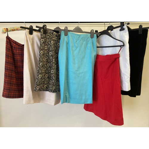 240 - A collection of 7 vintage skirts in varying styles and patterns. To include: black velvet pencil ski... 