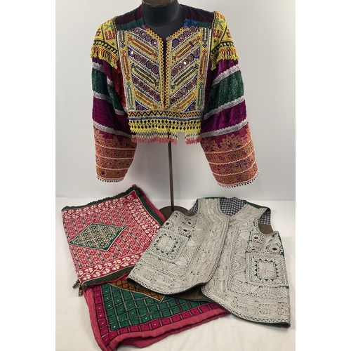 249 - A collection of vintage Central Asian clothing and textile items. To include a heavily beaded and em... 