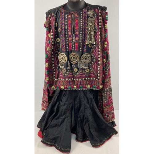 255 - A vintage Central Asian heavily embroidered Jumlo gown with metal embellishment. Embroidered in brig...