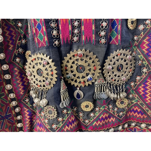 255 - A vintage Central Asian heavily embroidered Jumlo gown with metal embellishment. Embroidered in brig... 