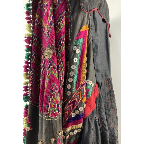 255 - A vintage Central Asian heavily embroidered Jumlo gown with metal embellishment. Embroidered in brig... 