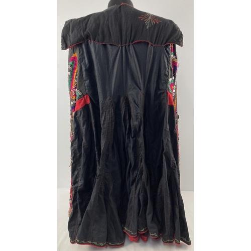 255 - A vintage Central Asian heavily embroidered Jumlo gown with metal embellishment. Embroidered in brig... 