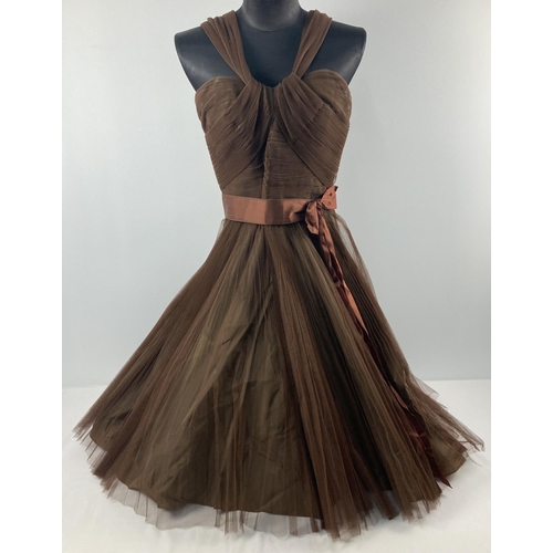 274 - A vintage 1950's sleeveless brown taffeta cocktail dress with netted overlay, by Susan Small. With s... 