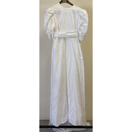 281 - A vintage 1960's broderie anglaise empire line short sleeved wedding dress with long bow and train t... 