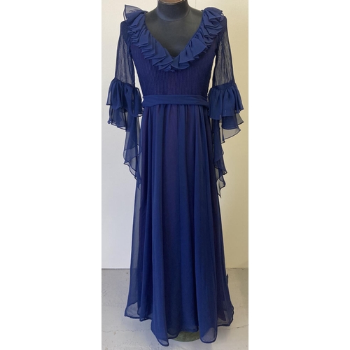 285 - A vintage 1970's Jean Varon midnight blue long sleeved chiffon evening dress. With pleated detail, r... 