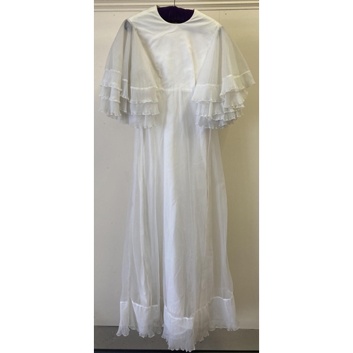 291 - A vintage 1970's white empire line wedding dress with tiered polyester chiffon angel sleeves.